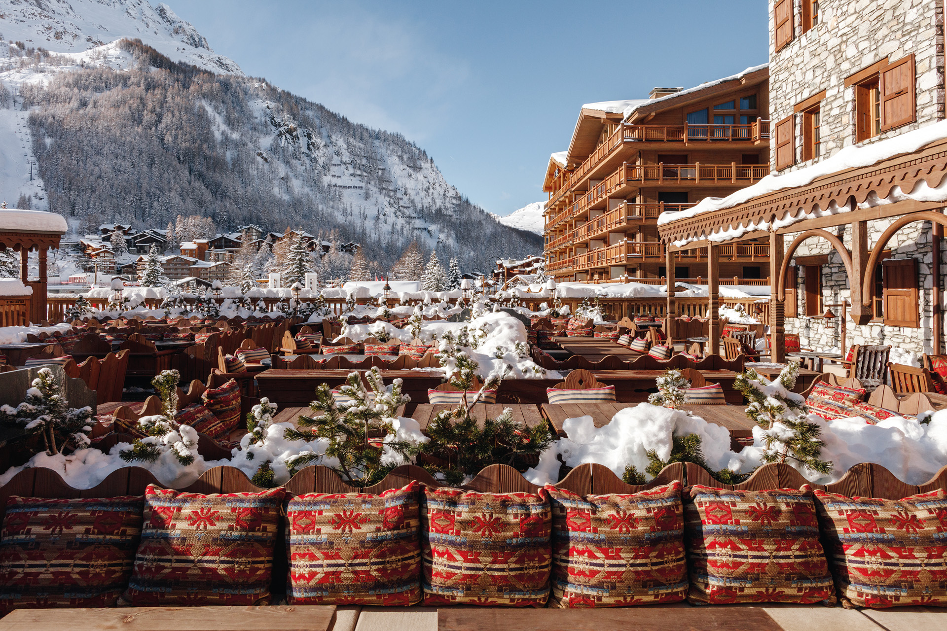 a wintery terrace with mountains in the background