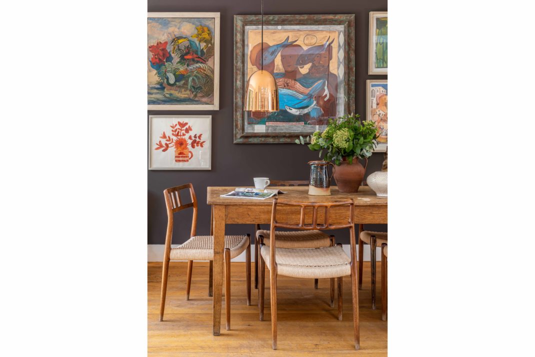 Boho style table art on walls chairs