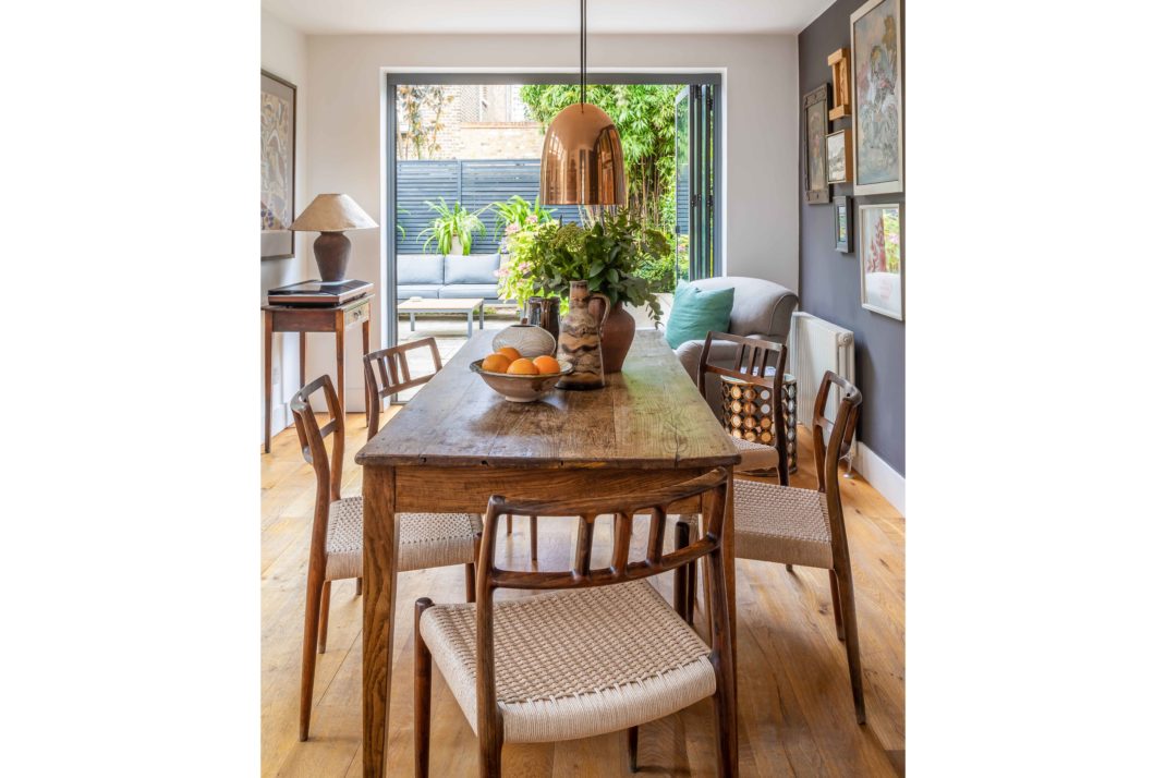 Boho decor table, bi-fold windows thorugh to garden