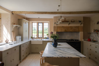an interior shot of a marble kitchen by British Standard by Plain English