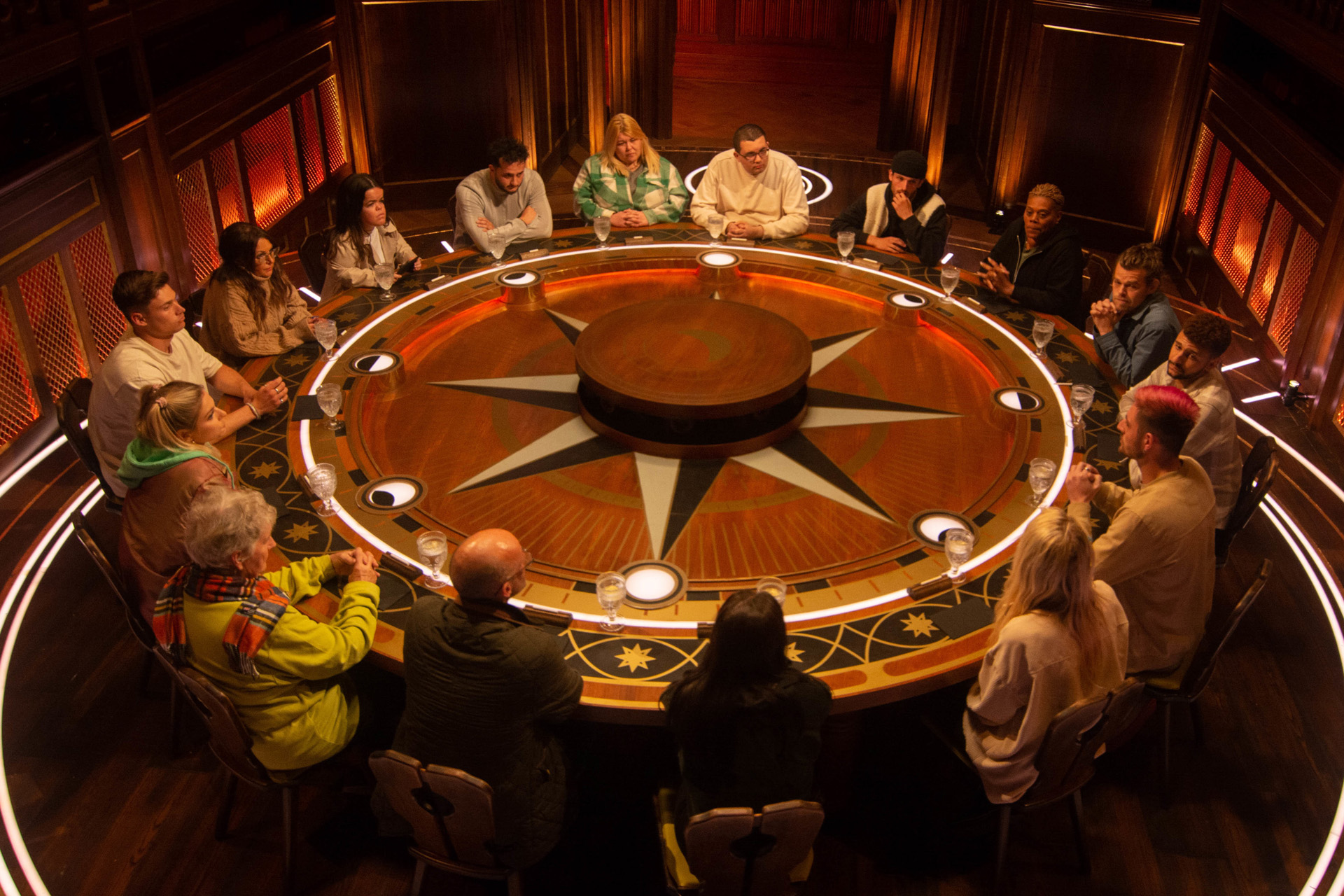 The cast of The Traitors at the nightly roundtable