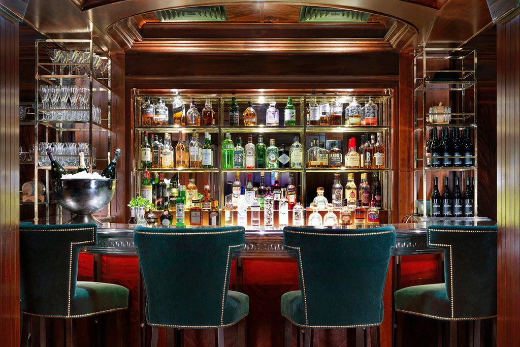 the bar with stools at Bloomsbury Club Bar