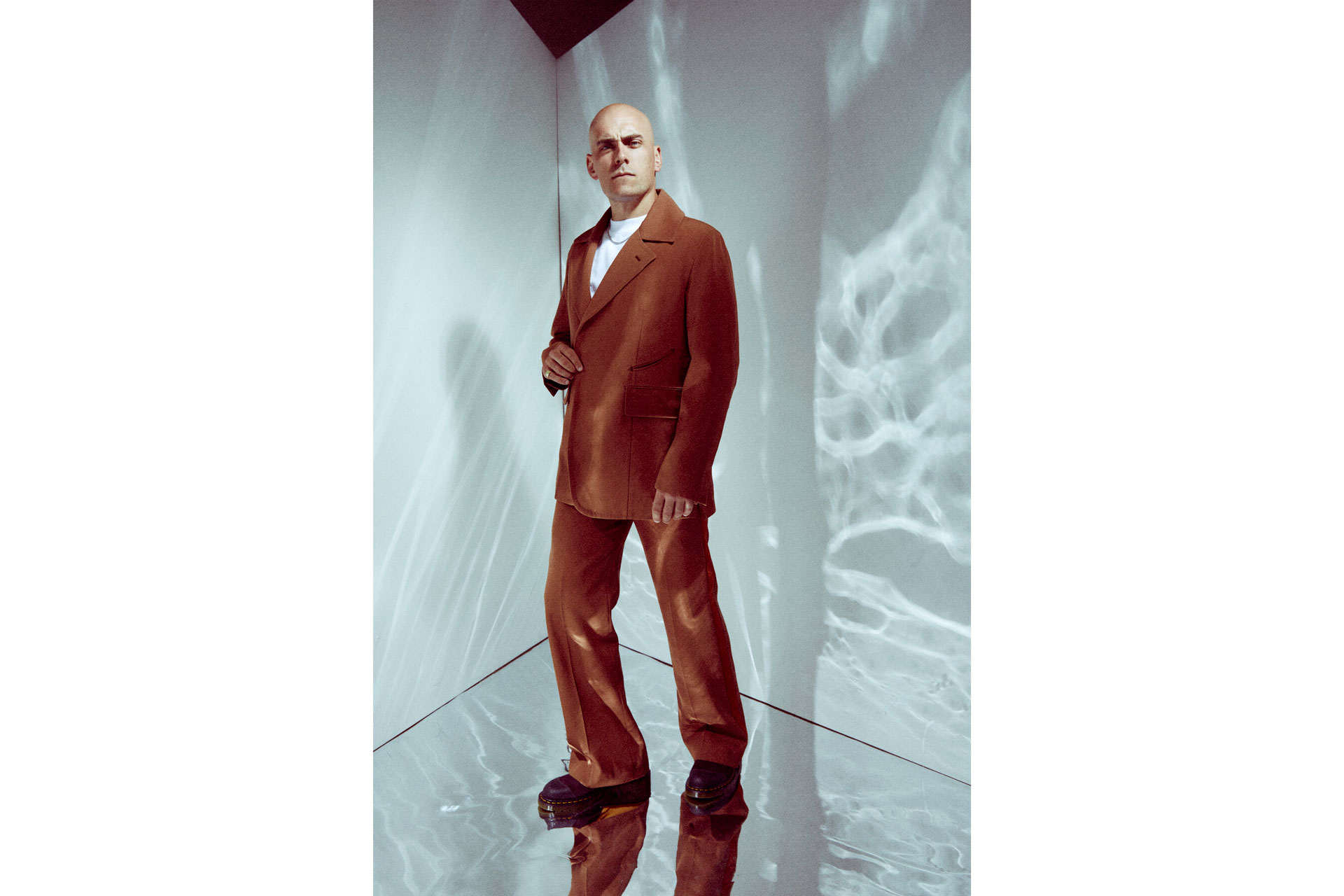 Samuel Edward Cook in a burnt orange suit