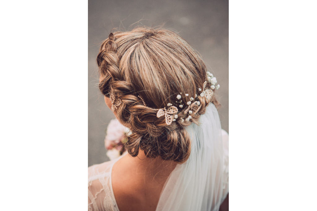 Close up of woman's hair with flowers in it
