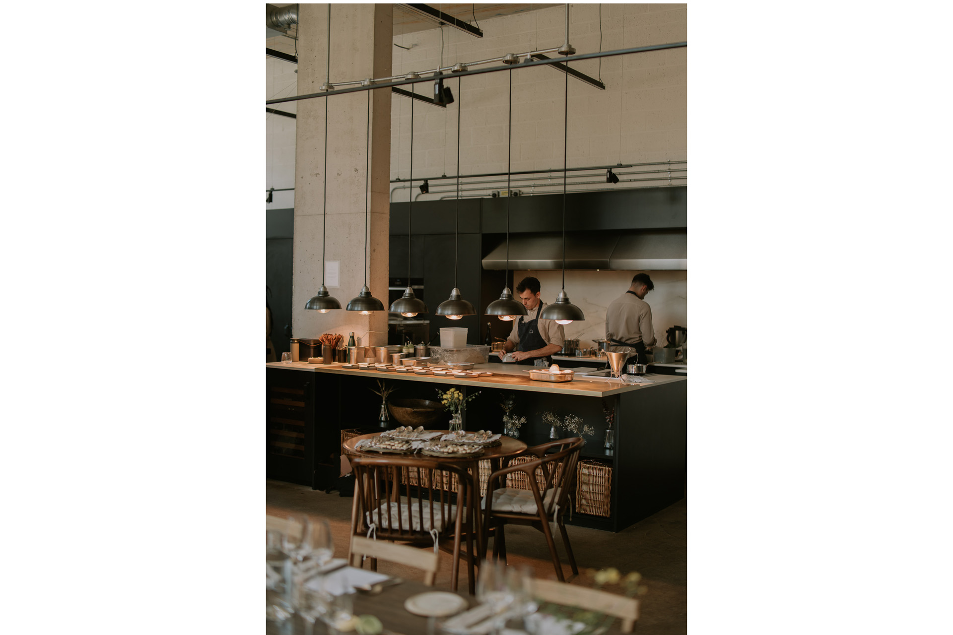 The open plan kitchen viewed from a dining table