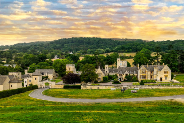 Sandstone buildings with greenery surrounding and a sunset