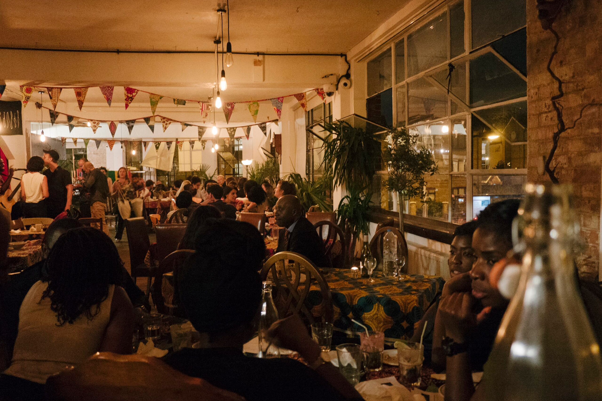 Group of people eating at Little Baobab supper club
