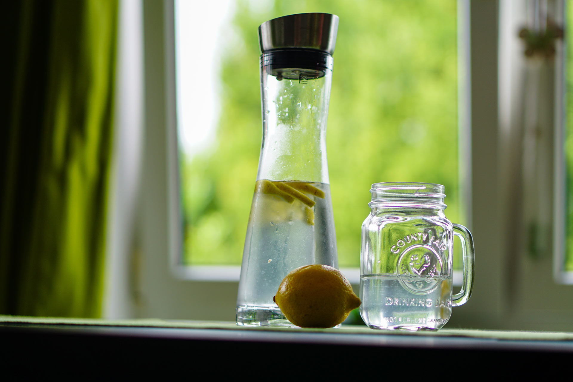 Glass of water by a window