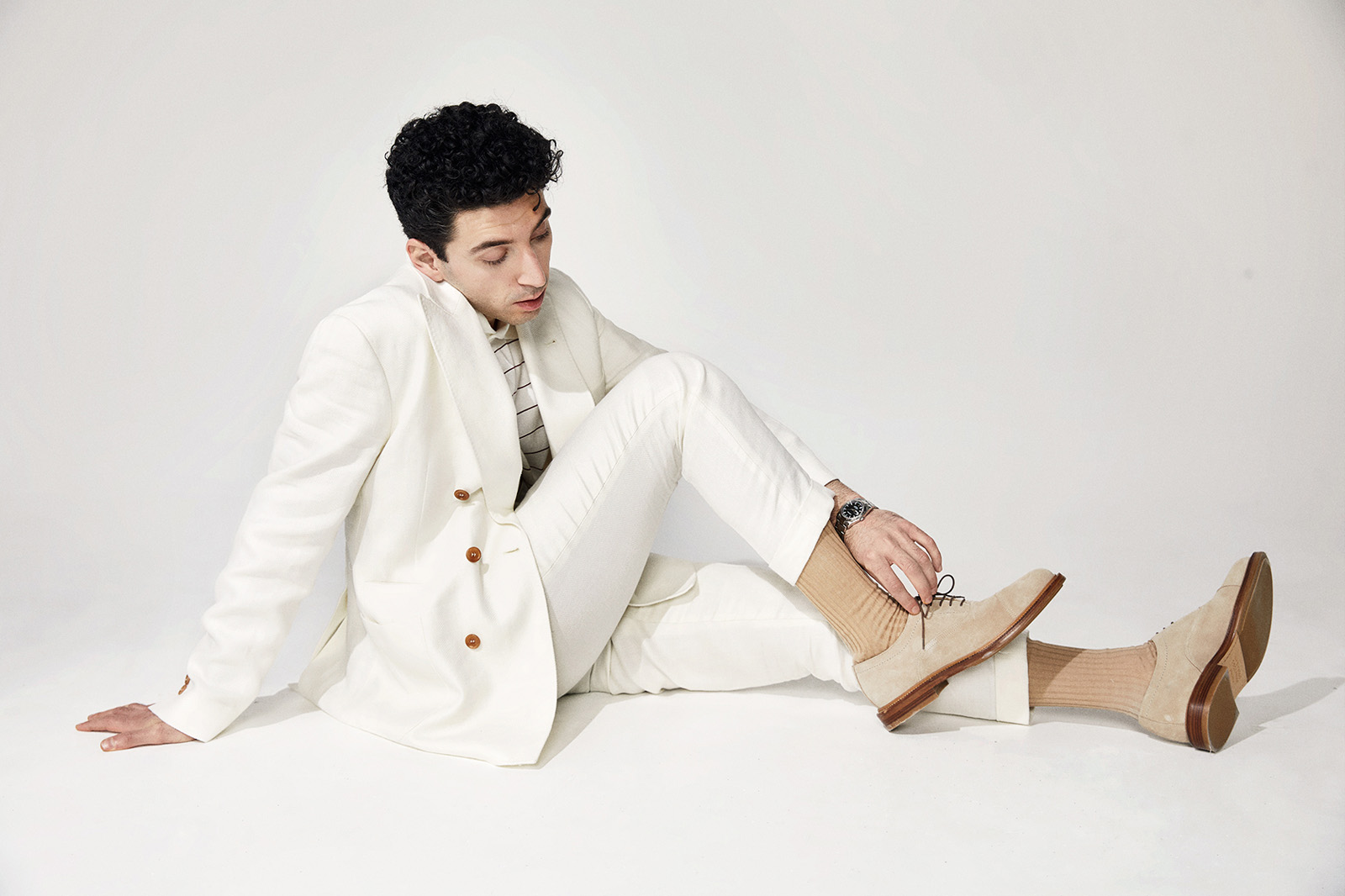 Aziz Dyab in a white suit