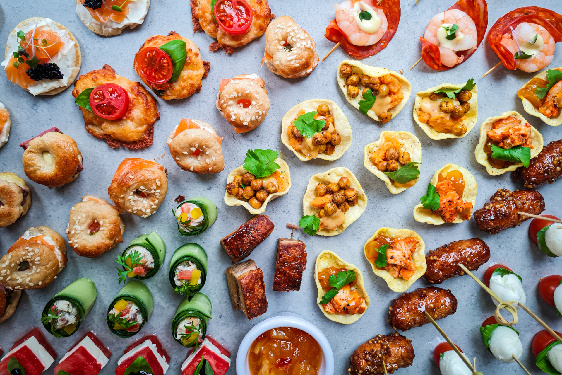Overhead view of canapes on light blue background