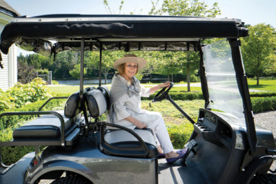 Nina Campbell in a golf buggy