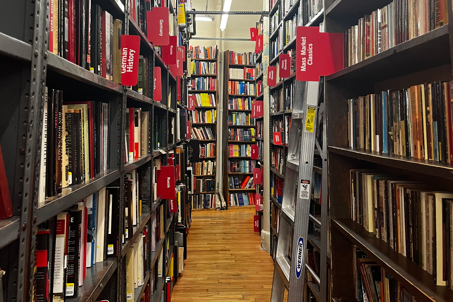 Bookshelves at Strand bookstore NYC with red divider labels