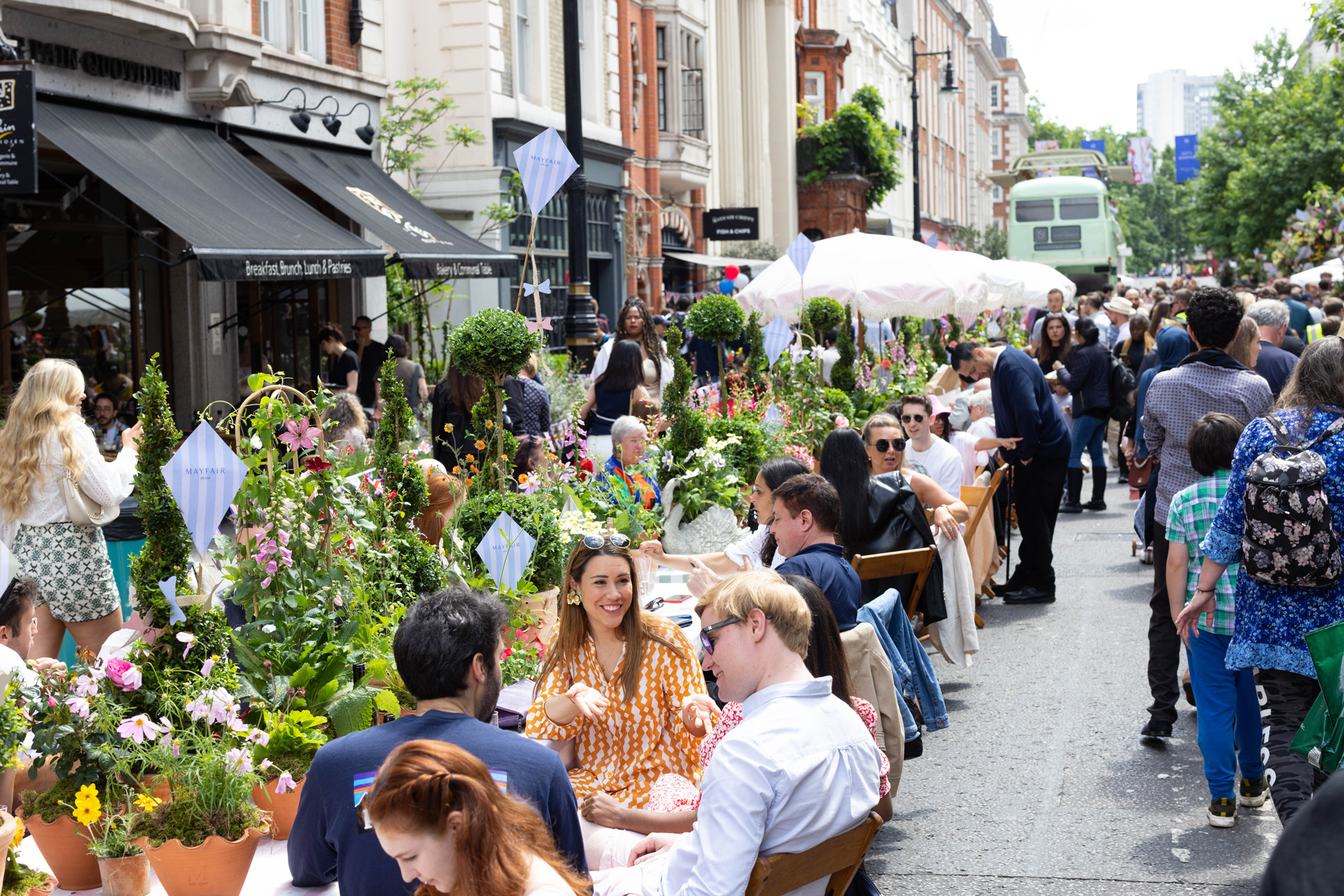 Members of the public attend The Mayfair Jubilee Street Party to celebrate the Queen’s 70-year reign, on North Audley Street, London.