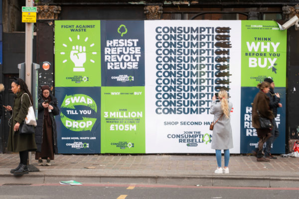 Posters on board on street in London