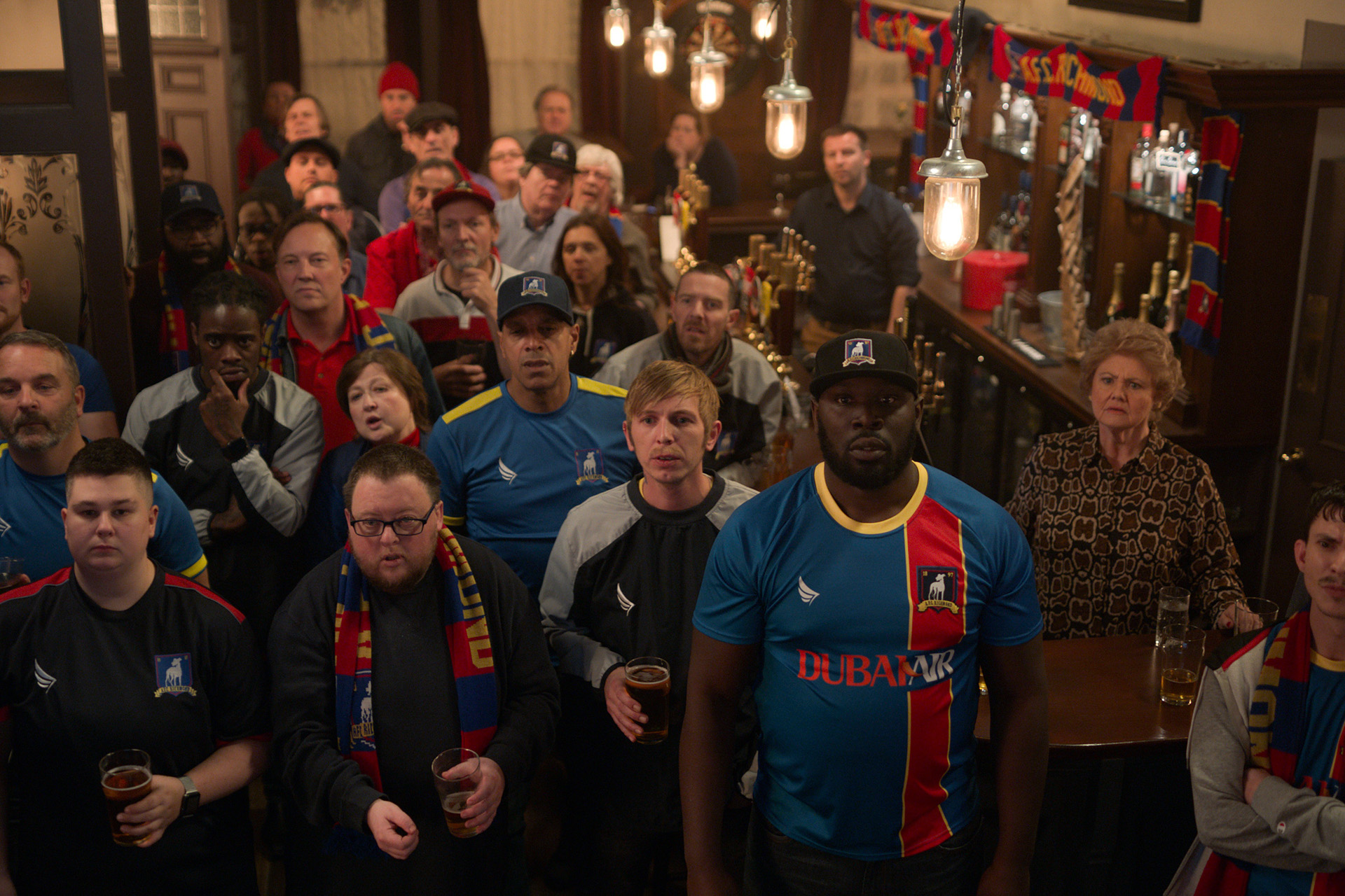 Bronson Webb, Kevin ‘KG’ Garry, Annette Badland and Adam Colborne in “Ted Lasso,” now streaming on Apple TV+.