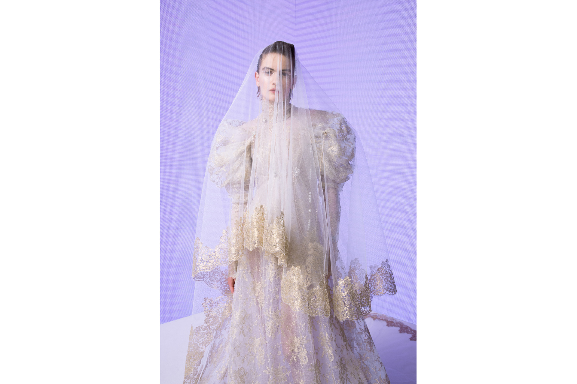 Woman in white dress and veil