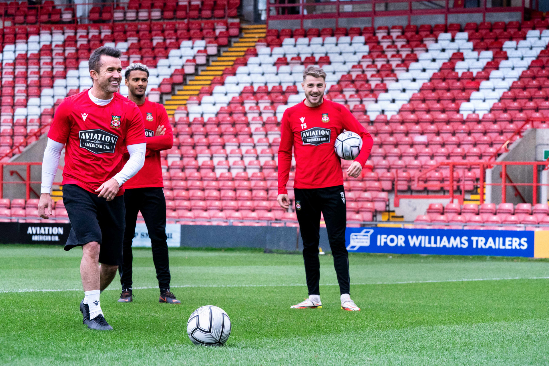 Rob McElhenney, Dior Angus and Tyler French playing football