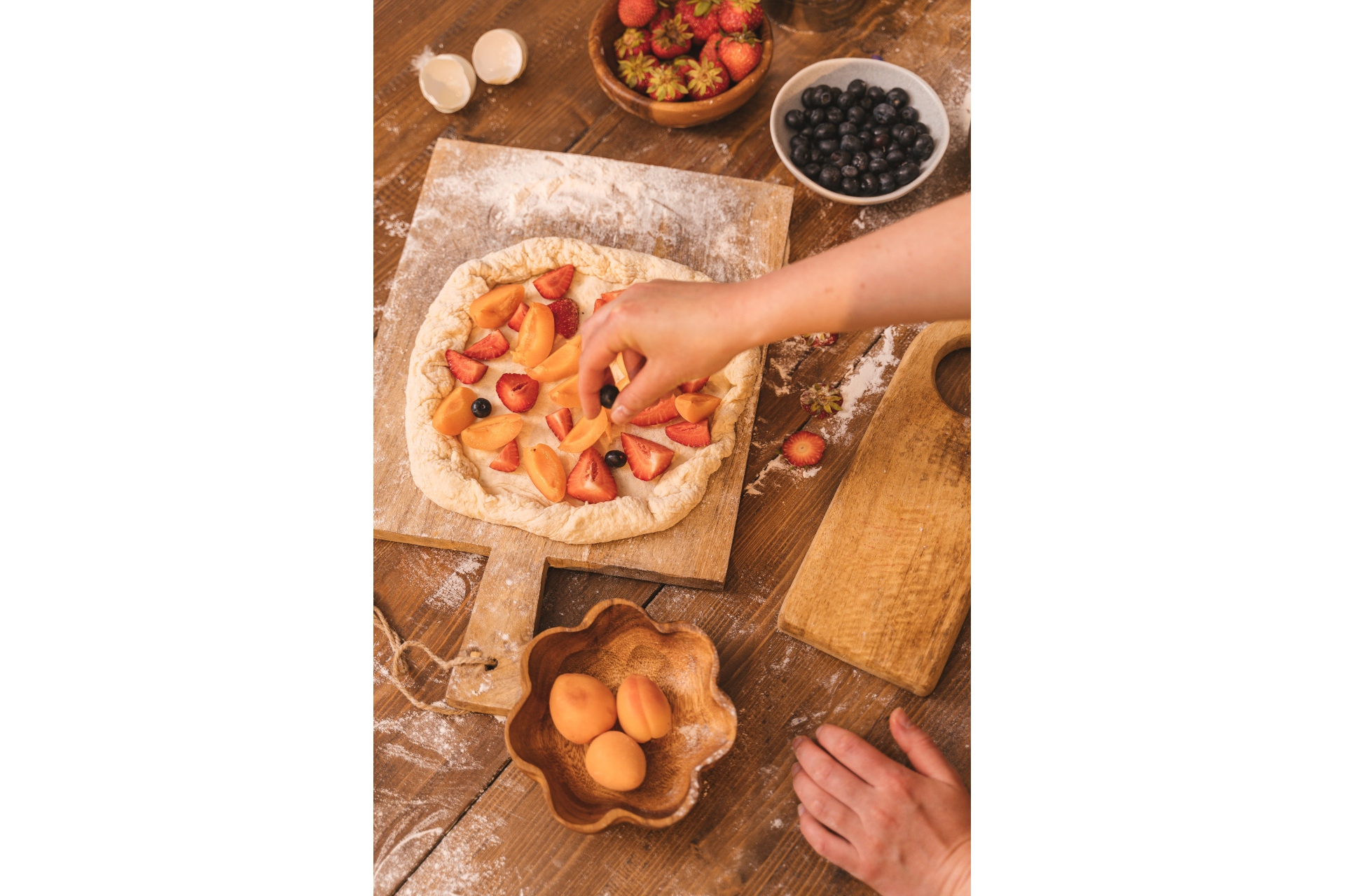 Someone assembling a galette