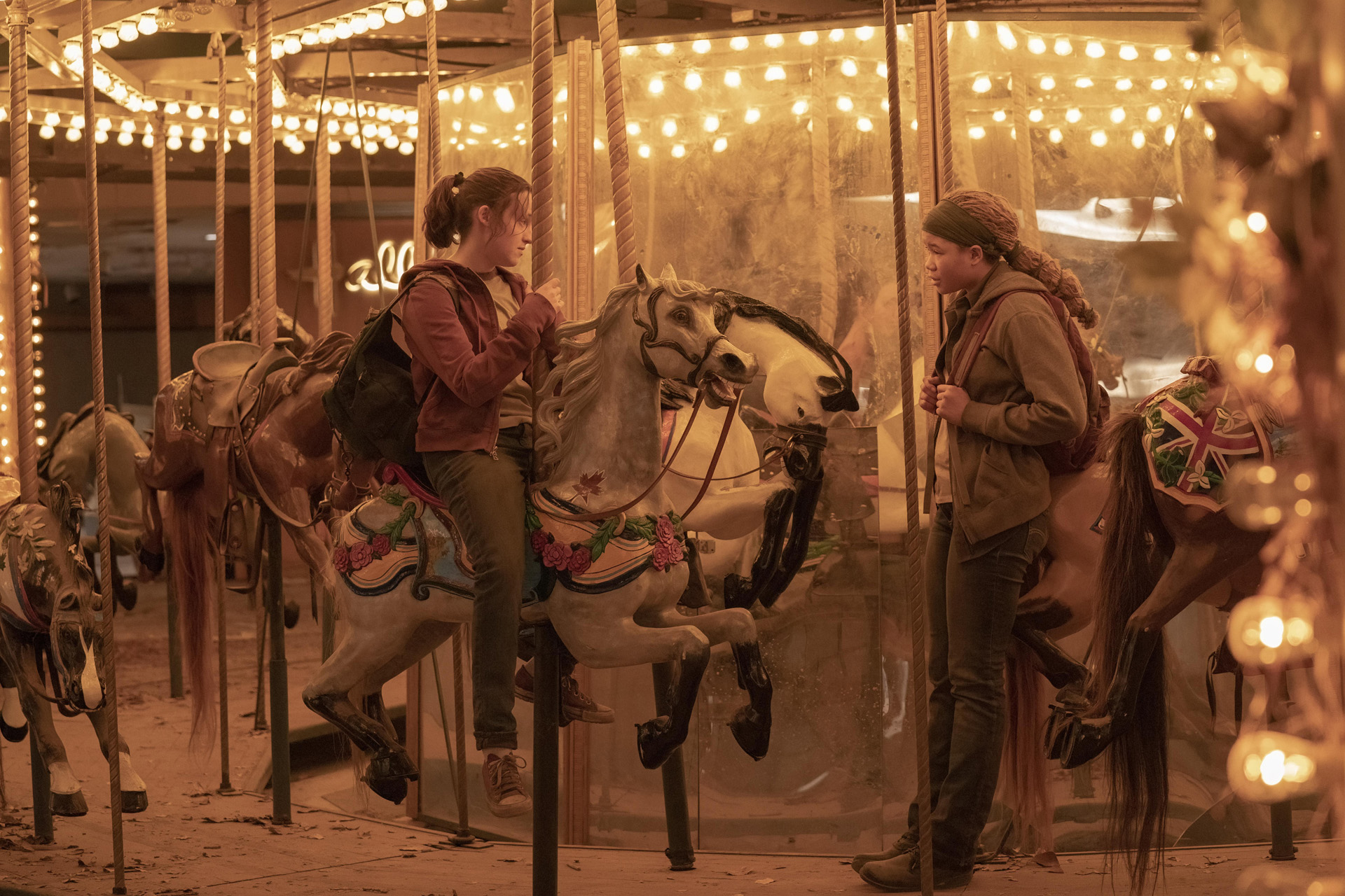 Bella Ramsey as Ellie and Storm Reid as Riley in The Last of Us