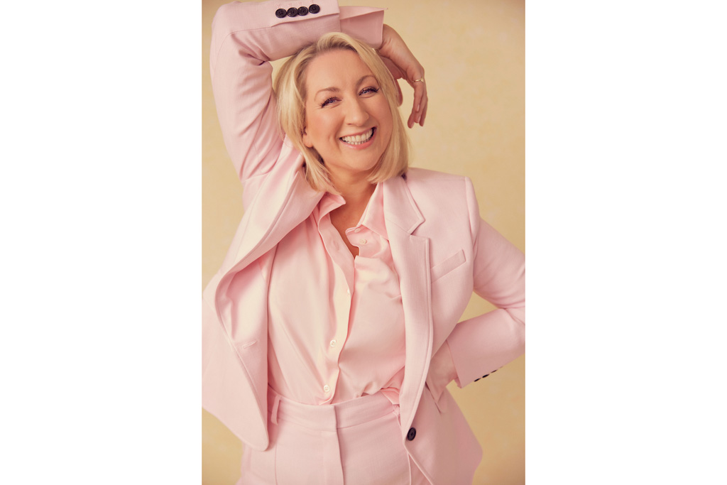 Maggie Service in a pink suit