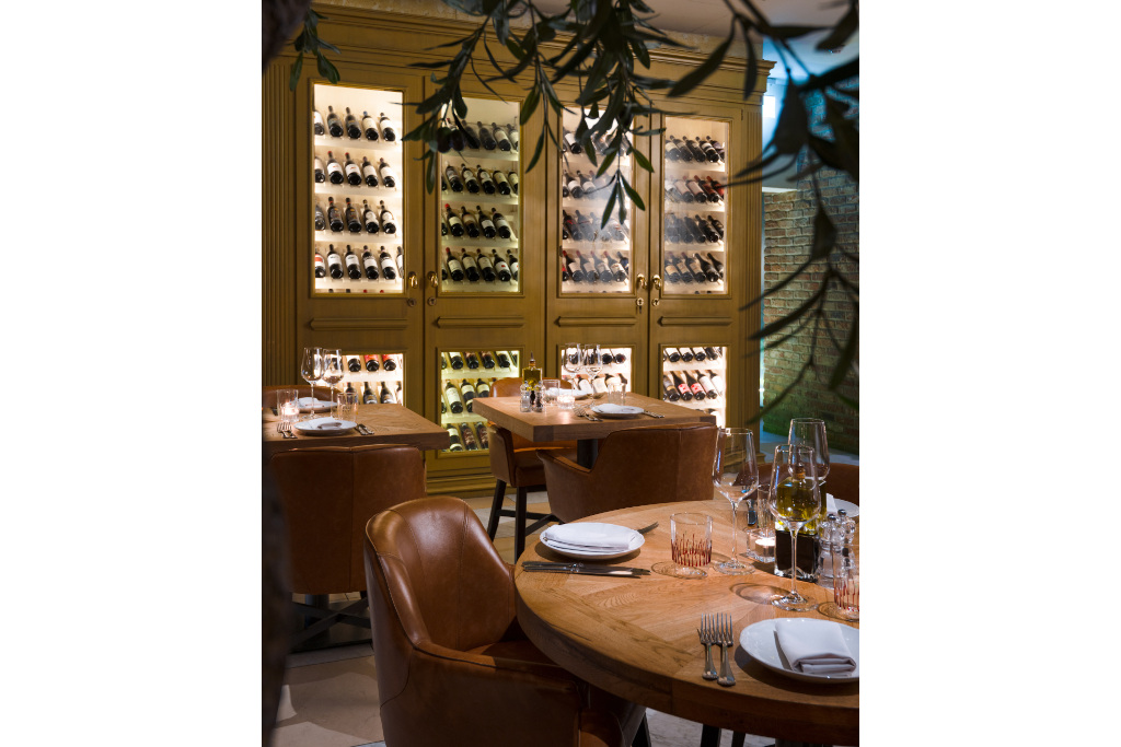 Restaurant with display of wine bottles on the wall