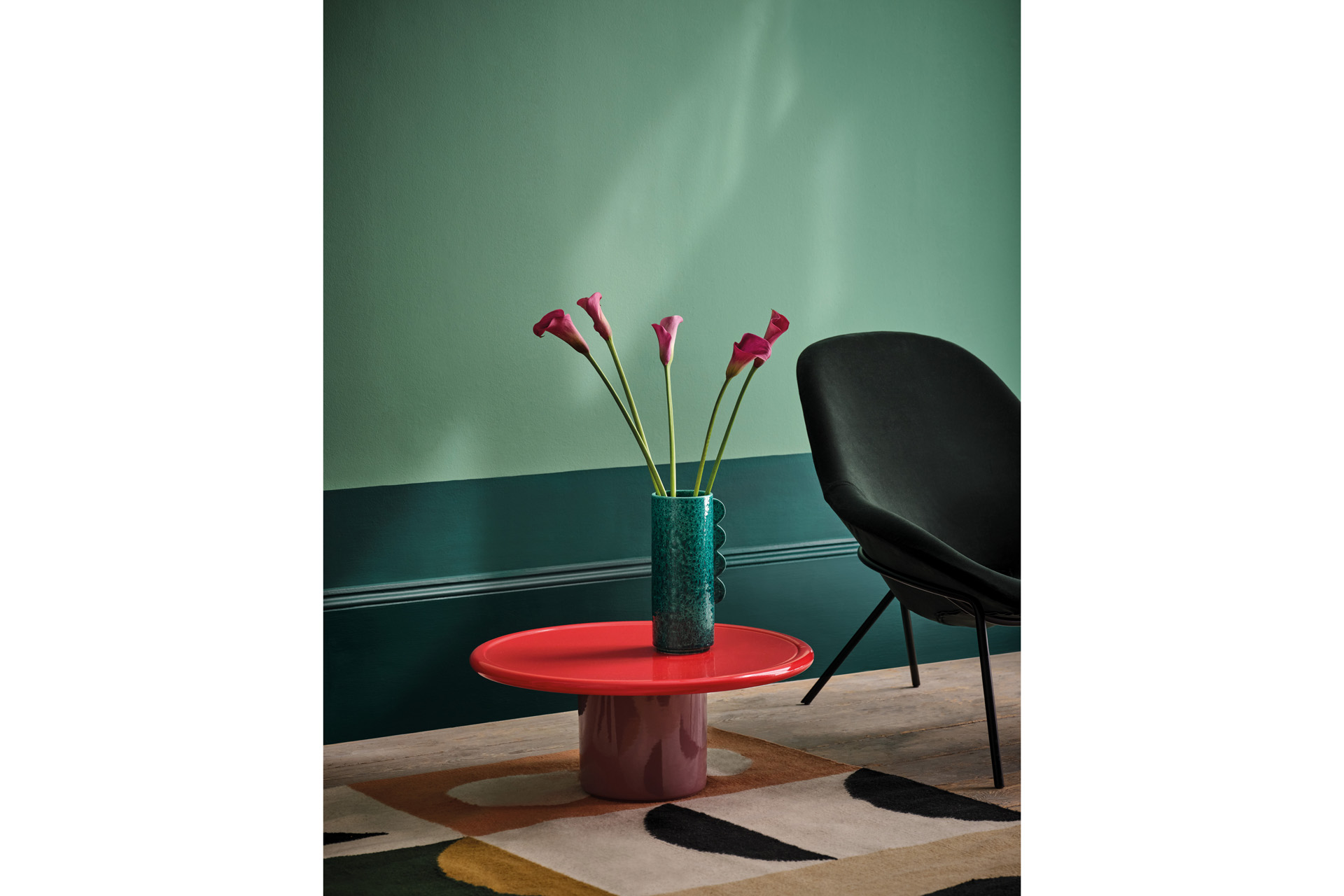 Brunswick Green on panelling and Nakajima on walls with furniture from the Conran Shop and Rug from Christopher Farr