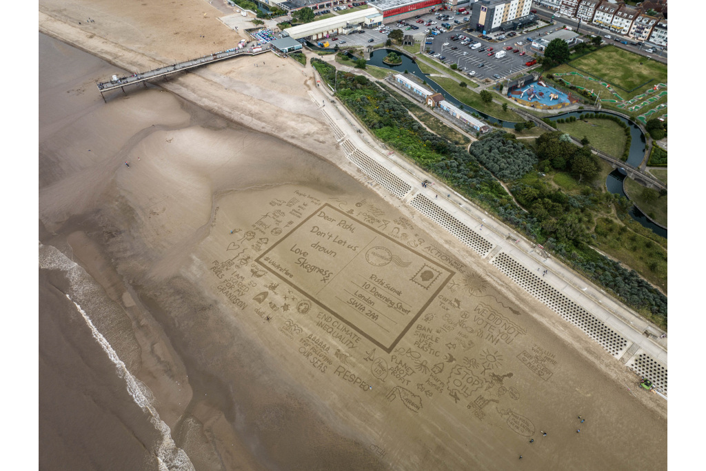 Postcard drawn in the sand
