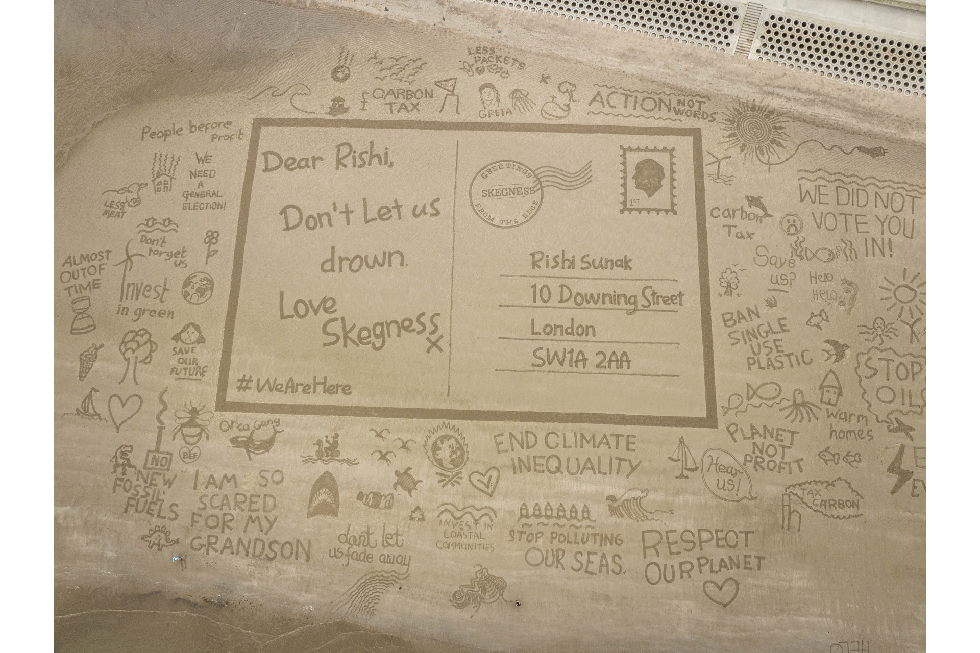 Postcard drawn in the sand