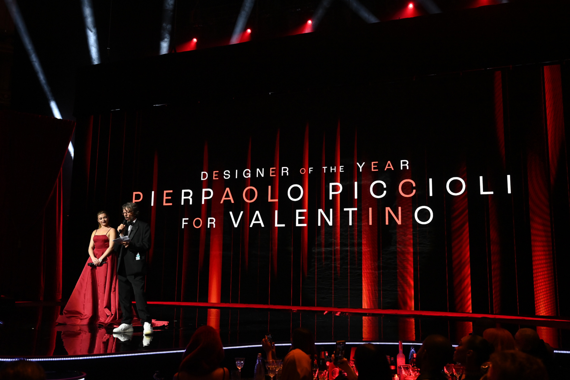 Florence Pugh presents the designer of the year award to Pierpaolo Piccioli for Valentino on stage during The Fashion Awards 2022
