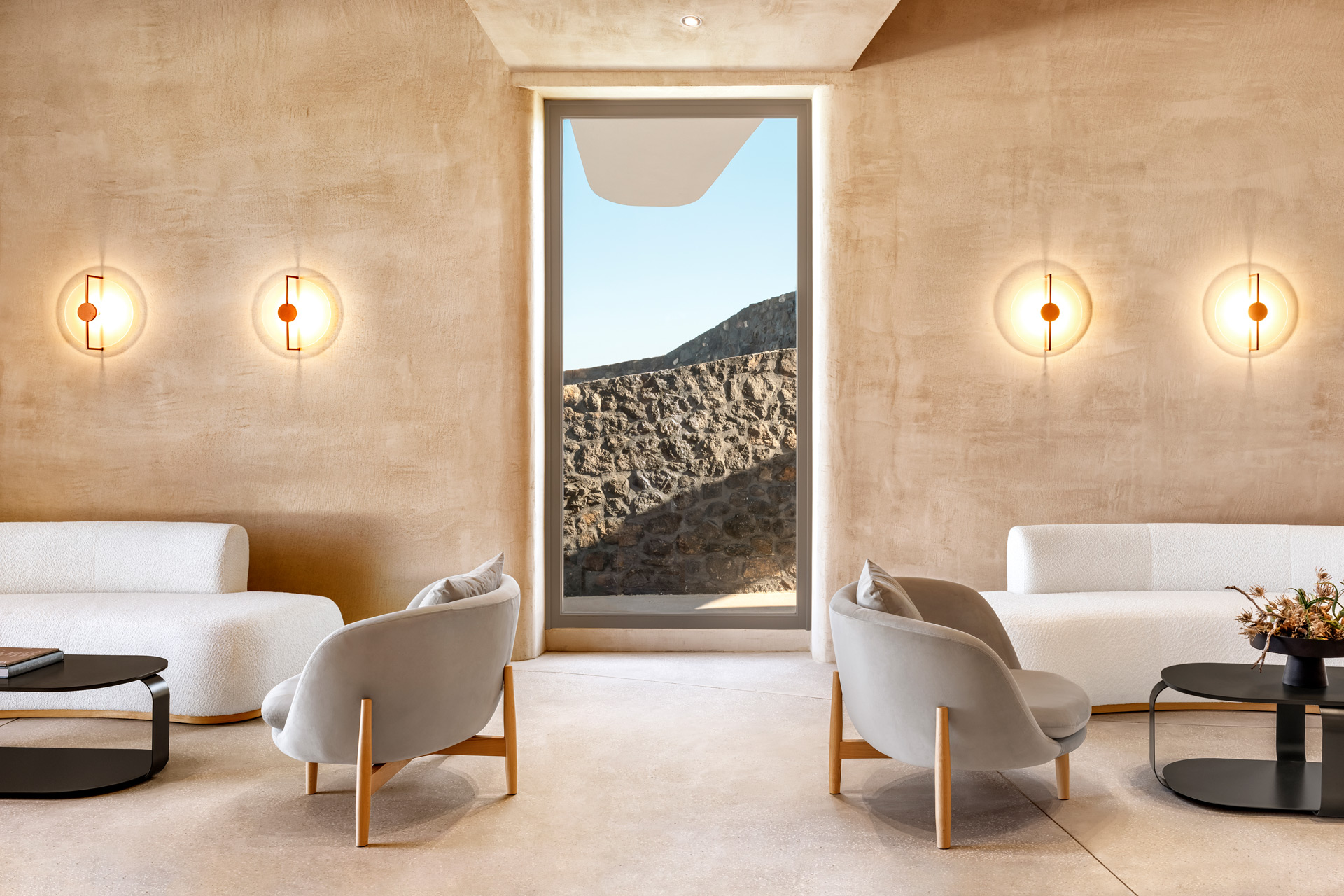 Reception area with limewash walls and white furniture