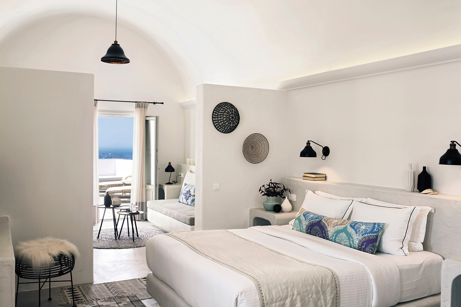 Bedroom suite with sea views at Santo Pure Resort.